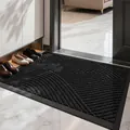 Solid black entryway doormat with 3D geometric dust-trapping pattern and non-slip rubber base - Wave-patterned - Black (tpe Bottom)