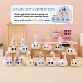 Honey Cat series blind box cat figurine in pastel pink with a long tail on a wooden table - -476 Honey Cats 12 / Full Set