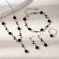 Detail view of black rose jewelry set featuring necklace, bracelet, earrings and ring - Necklace Bracelet Earrings And Ring Set (E4426) / Silver/Black