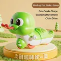 Green cartoon wind-up snake toy with big eyes and mechanical rolling wheels - Wind-up Fun Snake (Green)
