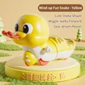 Wind-up yellow toy snake with segmented plastic body and crawling mechanism for kids - Wind-up Fun Snake (Yellow)