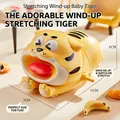 Yellow wind-up tiger toy stretching pose with q-version expression for toddlers - Wind-up Stretching Tiger