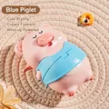 Pink and blue clockwork pig toy with retractable walking motion on a woven mat - Fun Wind-up Toy Pig (Blue)