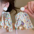 Elegant seashell stud earrings with blue polka dot ribbon bows and shell pendants - Blue Ribbon Sea Snail Shell Style (55#)