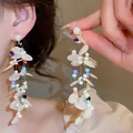 Elegant long tassel earrings featuring white petals and colorful beads with a pearl stud. - Beige Pearl Colored Bead Tassel (34#)