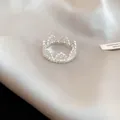 Silver crown lace ring with cubic zirconia on champagne silk fabric background - Silver Hollow Crown Style (41#)