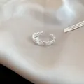 Elegant adjustable silver star ring with zircon inlay on champagne silk background - Silver Zirconia Star Open Style (34#)
