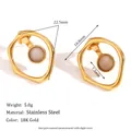 Irregular vintage earrings in 18K gold plated stainless steel with gray cat eye stone - Geometric Hollow Ring Cat Eye Stud Earrings - Gold White
