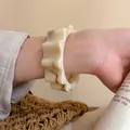 Creamy marble resin bangle with wavy gear design and irregular aesthetic on wrist - 42# Beige