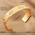 Detailed view of 18K gold plated stainless steel evil eye bangle with white stones - Gold Bohemian Evil Eye Style (58)