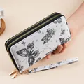 Long double zipper wallet for women featuring black butterfly prints and wristlet strap - Black