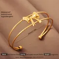 Elegant 18k gold plated stainless steel bow open cuff bracelet for women - Gold Bow Texture Style