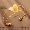 Exaggerated 18k gold plated stainless steel open heart bangle with spiral texture - Gold Heart Style