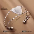 Silver stainless steel heart bangle featuring a twisted band and 64mm inner diameter - Silver Heart Style