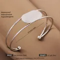Silver open adjustable stainless steel bangle with hammered texture and round accents - Silver Oval Hammered Style