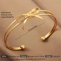 Exaggerated 18k gold plated stainless steel bow cuff bracelet with snake chain texture - Gold Bow Fragment Style