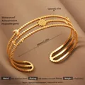 Exaggerated 18k gold plated stainless steel open bangle featuring celestial sun moon star motifs - Gold Hollow Sun Moon Star Style (33)