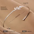 Elegant silver-colored stainless steel open bangle with hollow rose and leaf pattern - Silver Rose Style (42)