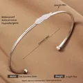 Adjustable open feather pattern bangle in silver-tone stainless steel with sphere ends - Silver Leaf Stainless Steel Style (51)