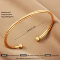 Adjustable 18k gold-plated stainless steel open bangle with textured double-strand design - Gold Spaced Texture Style (56)