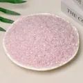 Natural rose quartz crystal gravel stones displayed in a white ceramic dish - Rose Quartz (3-5mm) 100g