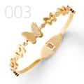 Close-up of gold stainless steel butterfly bangle with matte finish and rhinestones - Star Hollow Frosted Butterfly Style (003)