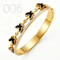 Close-up of gold butterfly bangle with black enamel and sparkling zircon accents - Black Butterfly Double Layer Row Diamond Style (006)