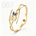 Detail of gold butterfly bracelet with black enamel and matte gold textured wings - Black Drip Oil Frosted Double Butterfly Style (007)