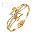 Detailed view of golden butterfly bangle featuring sandblasted finish and zircon pavé - Streamlined Zirconia Sand Surface Double Butterfly Style (009)