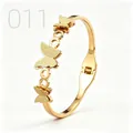 Detail of gold butterfly bangle showing sandblasted texture and hinged clasp mechanism - Three Sizes Butterfly Hollow Circle Style (011)