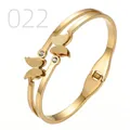 Detail of gold butterfly bangle with spring hinge and sparkling crystal accents - Frosted Double Butterfly Round Bead Style (022)