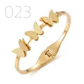 Detail of gold butterfly bangle featuring matte wings and a sparkling zircon stone - Three Frosted Butterfly Point Diamond Style (023)