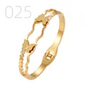 Detail of gold butterfly open bangle with crystal accents and wavy double-layer steel design - Wavy Double Layer Frosted Butterfly Style (025)