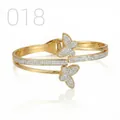 Detail of gold butterfly bangle with pave-set zircon stones and spring hinge closure - Staggered Pave Butterfly Style (018)