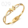 Detailed macro of gold butterfly bangle featuring frosted wings and sparkling crystals - Infinity Frosted Butterfly Main Diamond Style (029)