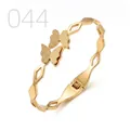 Elegant gold butterfly stainless steel bangle featuring matte wings and geometric hollow band - Geometric Hollow Double Frosted Butterfly Style (044)