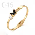 Golden stainless steel butterfly bangle with black clover and shell inlay finish - Mother of Pearl Clover Butterfly Zirconia Style (046)