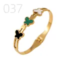 Golden stainless steel butterfly bangle with black, green, and white inlay details - Three-color Mother of Pearl Butterfly Beaded Edge Style (037)
