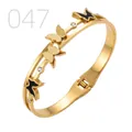 Golden butterfly bangle with double-layer hollow ring and black enamel details - Hollow Frosted Enamel Multi-butterfly Style (047)
