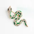 Sparkling green enamel snake brooch with clear rhinestones on gold alloy base - Green