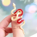 Intricate gold snake brooch adorned with sparkling red rhinestones for SKU display - Gold with Red Rhinestones