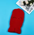 Bright red knitted 3-hole balaclava ski mask with ribbed texture on blue background - 2-Hole Knit / Red