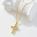 Gold plated cross necklace with zircon stones and pearl detail on vintage white background - Gold/Round Center Pavé Zirconia Cross/B2