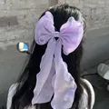 Elegant purple organza bow hair clip with long ribbons on dark hair for women - Purple Ribbon Duckbill Clip