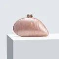 Detail of champagne pink marble texture acrylic evening clutch with gold metal ball clasp - Lotus Pink