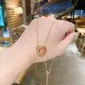 Elegante collana in acciaio al titanio oro rosa con doppio anello intrecciato - Stile a doppio anello con zirconia (X015) / Oro rosa