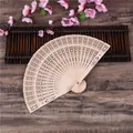Classic Chinese 8-inch hollowed-out wooden folding fan with intricate floral carvings - Fully Punched Style