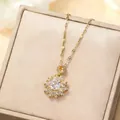 Luxurious gold flower pendant necklace with shimmering zircon crystals in a premium gift box - Gold