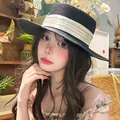 Elegant black woven straw sun hat featuring a cream yellow satin ribbon bow detail - Black Satin Ribbon Boater Hat (D-582)