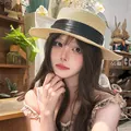 Summer straw sun hat for women featuring a flat top and elegant black ribbon bow detail - Beige Black Ribbon Boater Hat (D-582)